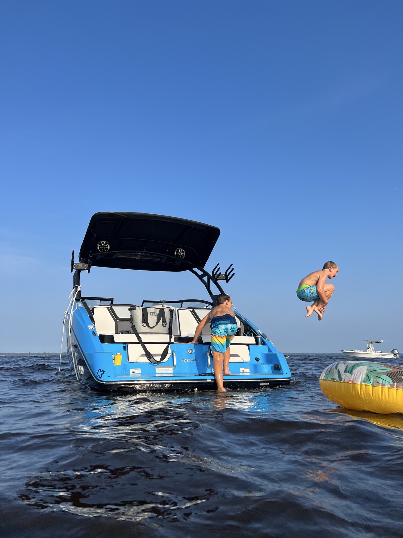 Family swimming from the boat