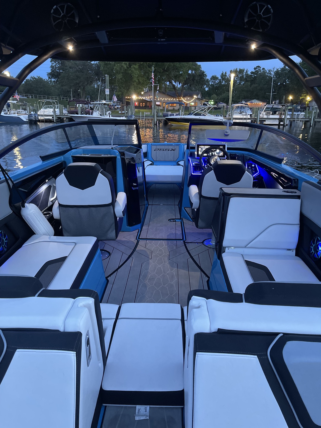 Blue-lit boat interior at the marina