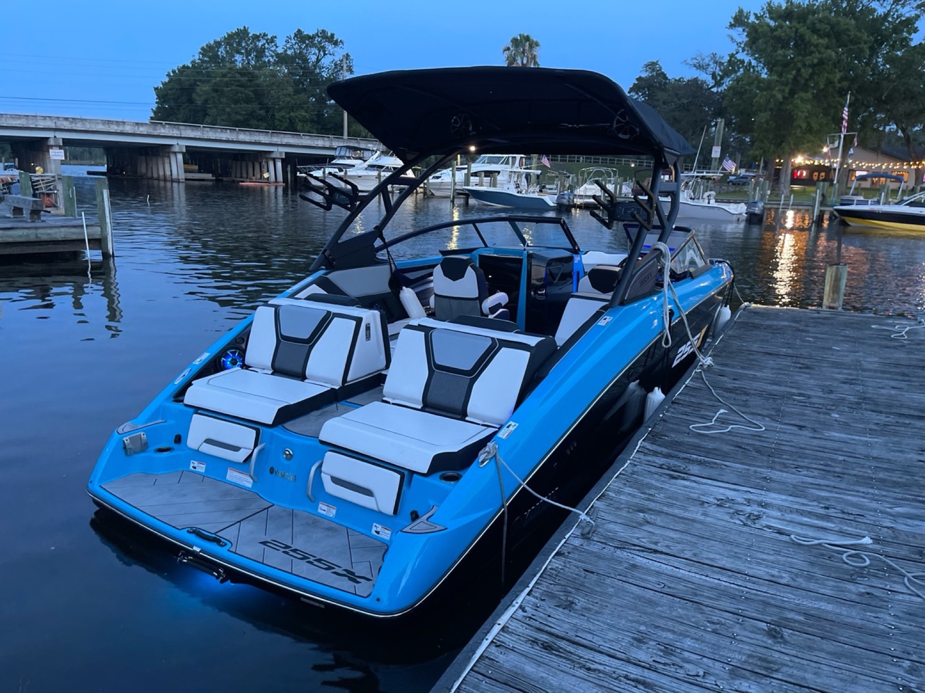 Rear view of the blue charter boat at dusk