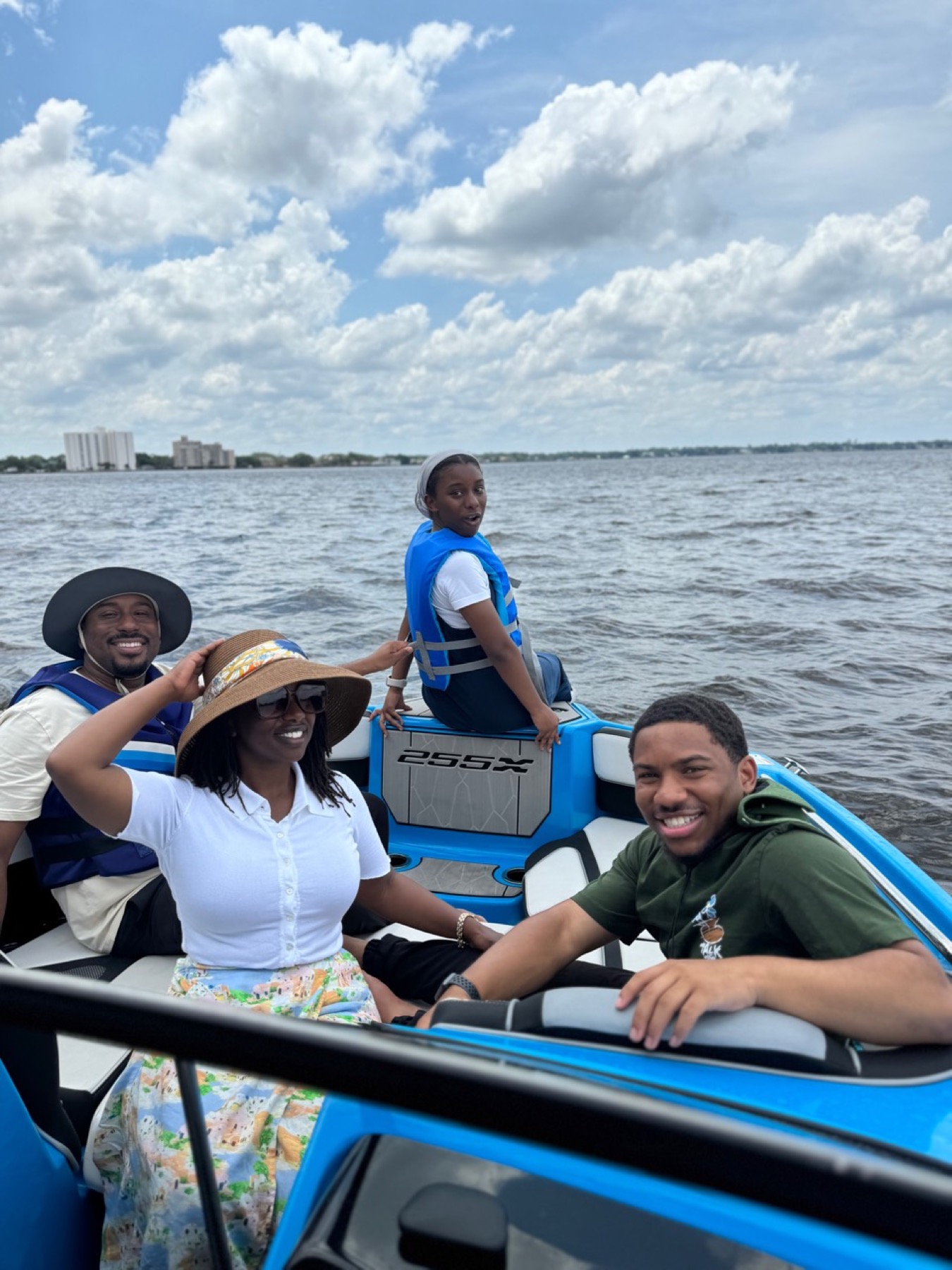 Family seated together on the boat