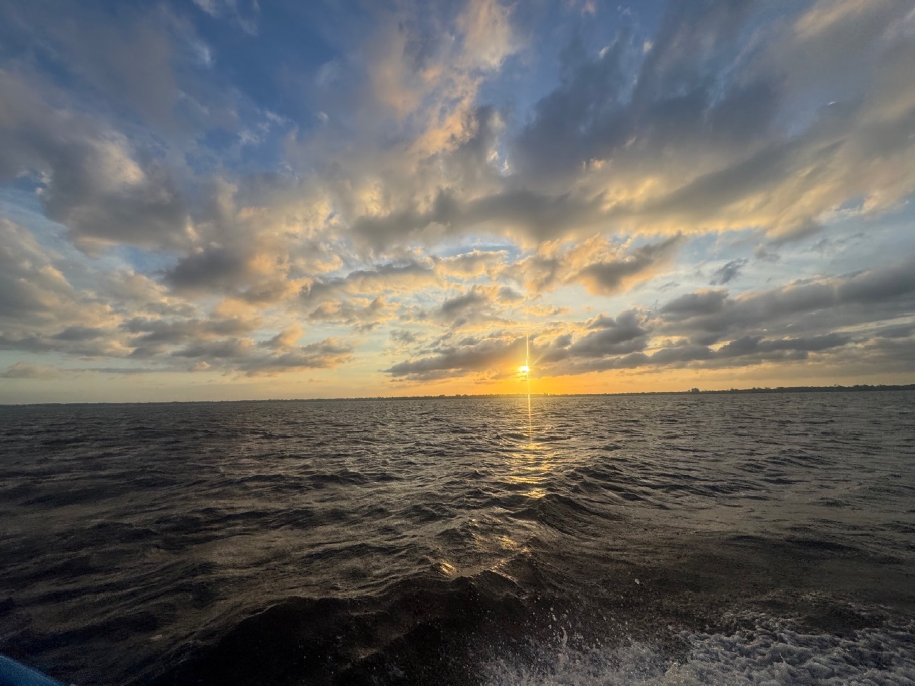 Sunset over the water during a charter