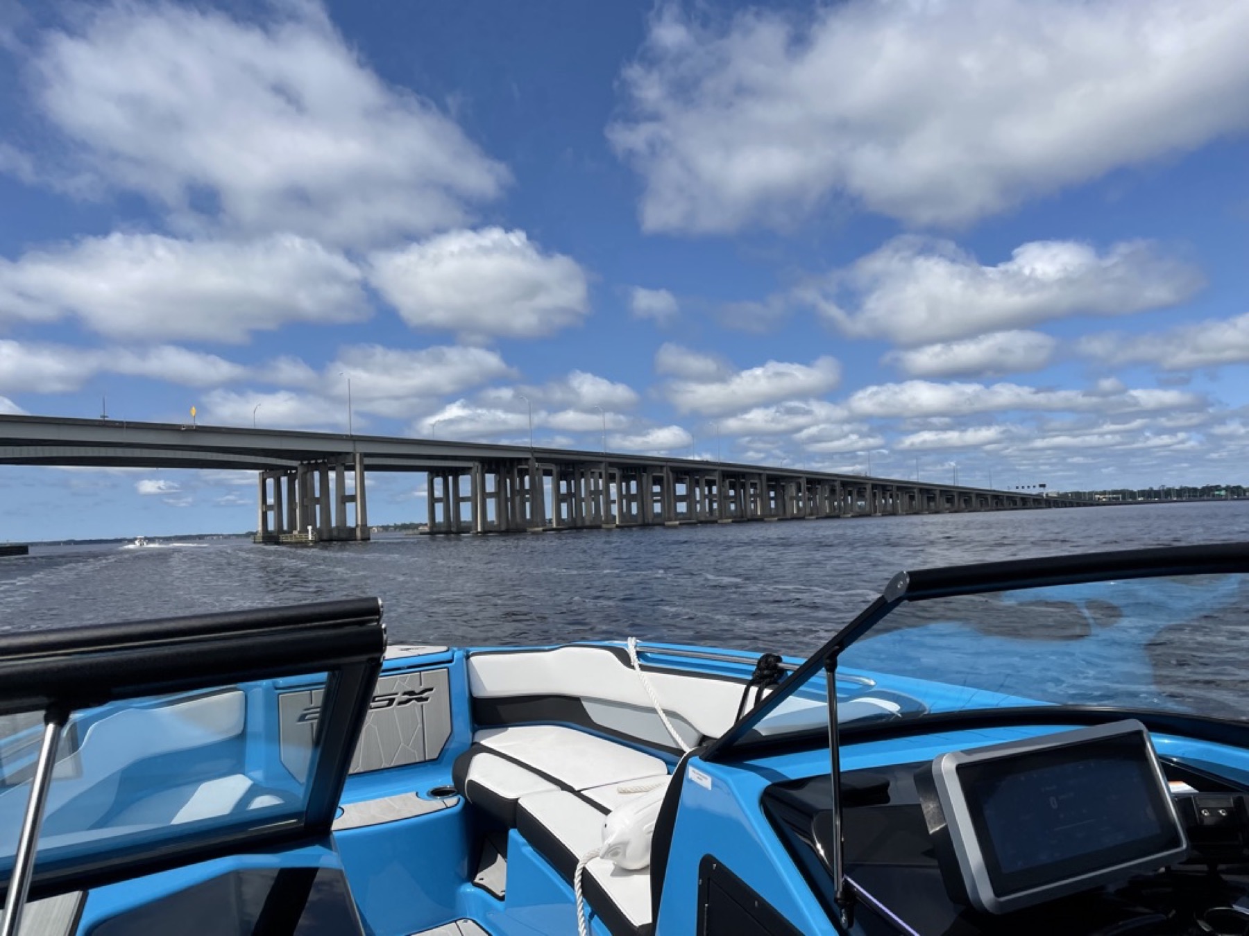 Lifestyle Jax H20 boat on Jacksonville water near a bridge